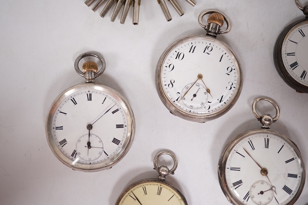 Three early to mid 20th century silver open faced pocket watches, with Roman or Arabic dials and subsidiary seconds, including two keyless and one key wind (Admiral Tacy Watch Co), together with one smaller silver open f